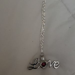 Silver necklace with love pendant with interchange